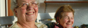 Two older women smiling