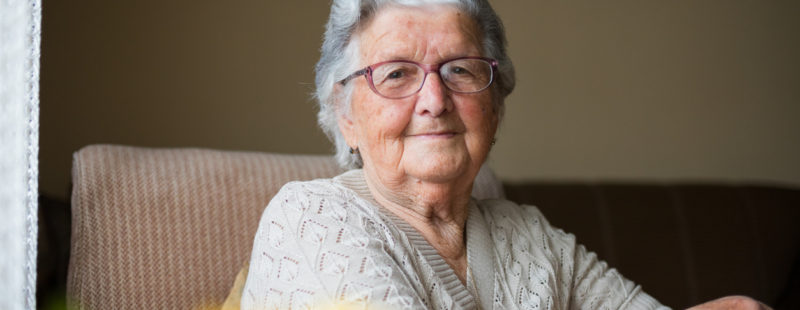 An older women, smiling at the camera